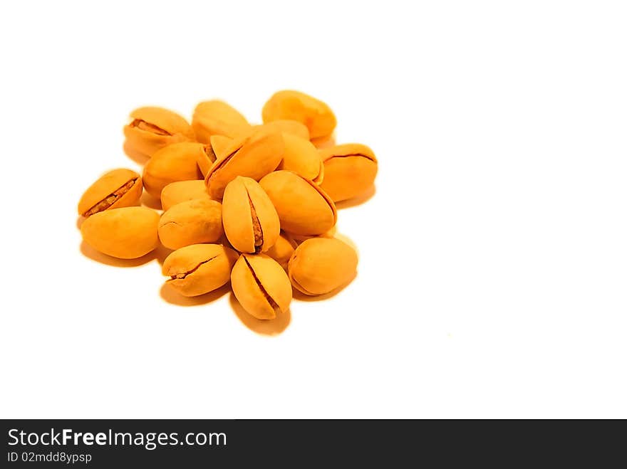 yellow pistachio nuts isolated on white