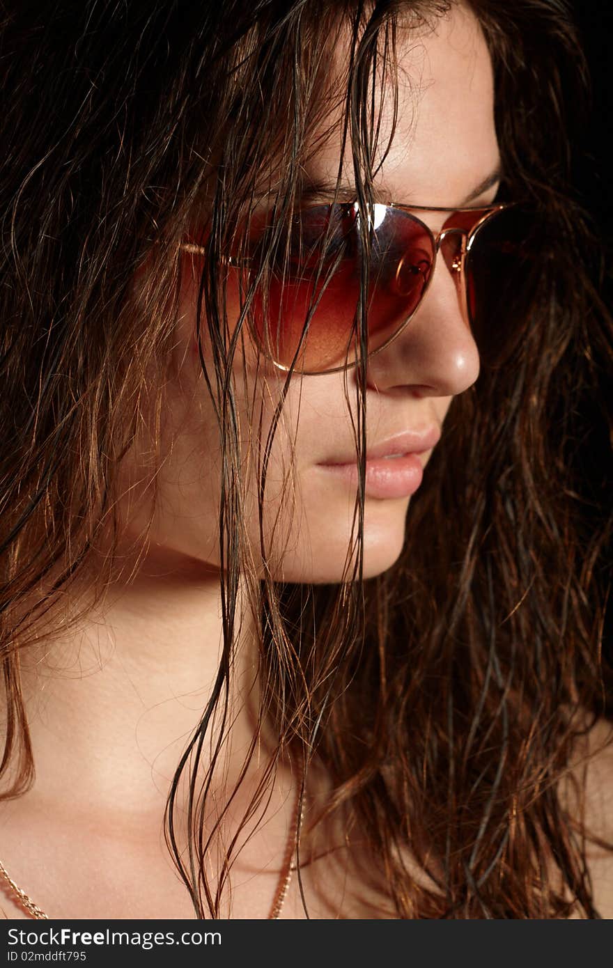 Girl in sunglasses. studio shot