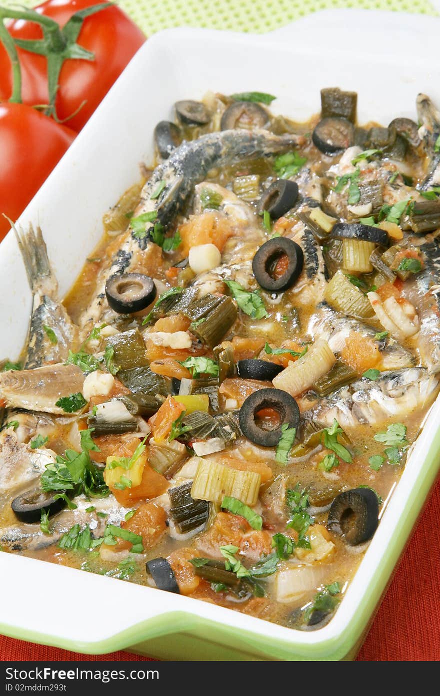 Fresh cooked sardines with vegetables