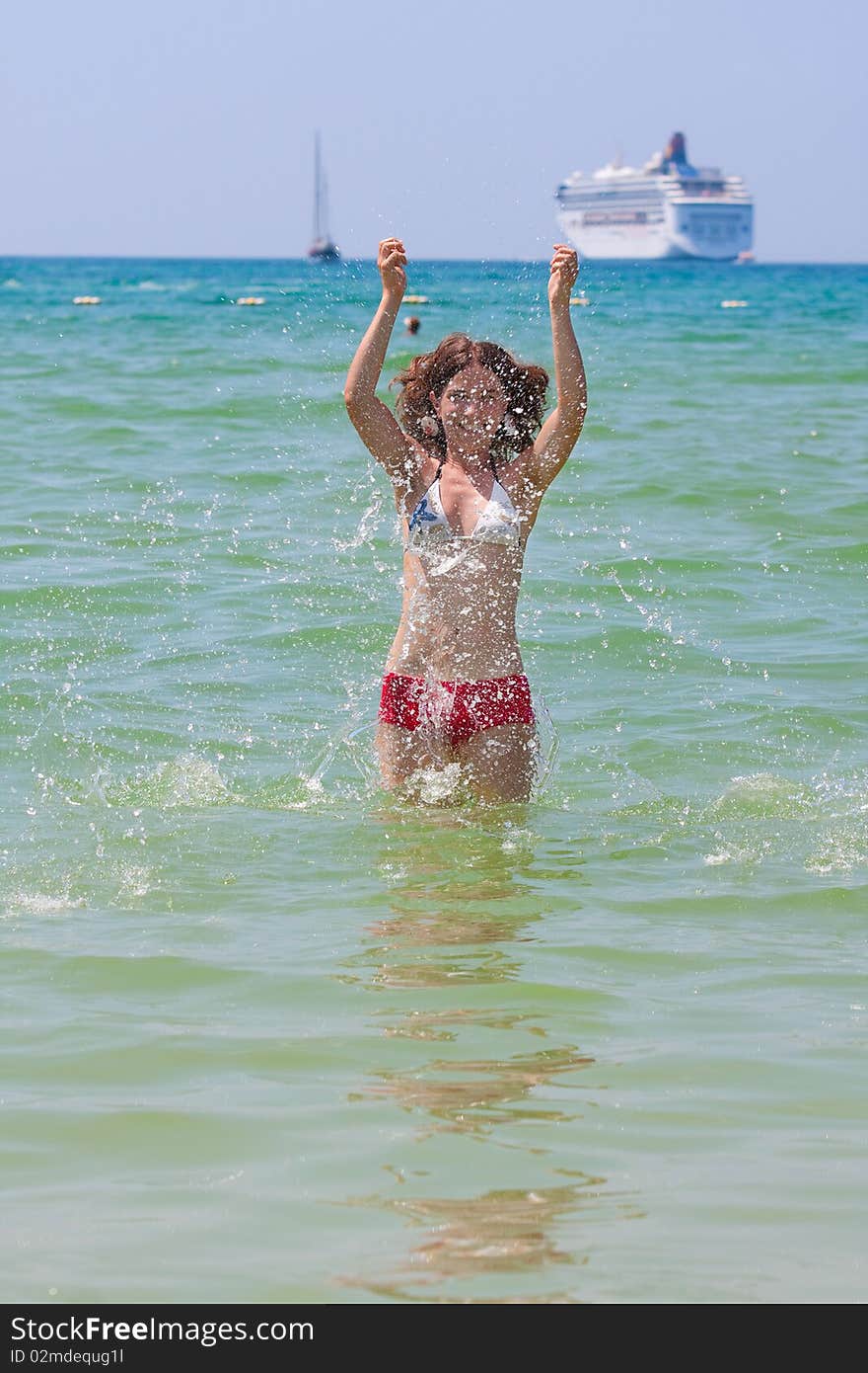 Girl with long hair playing in the sea. Girl with long hair playing in the sea