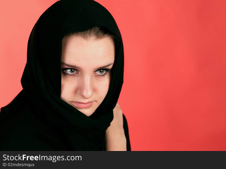 Girl in black clothes on the red background. Girl in black clothes on the red background