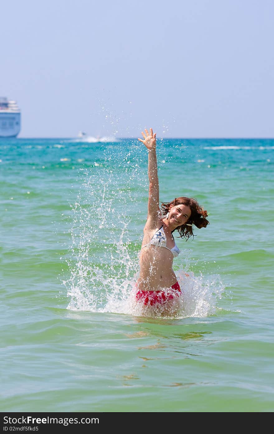 Girl with long hair playing in the sea. Girl with long hair playing in the sea