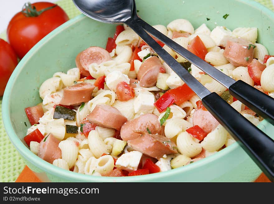 Delicious pasta salad with paprika and frankfurter sausage