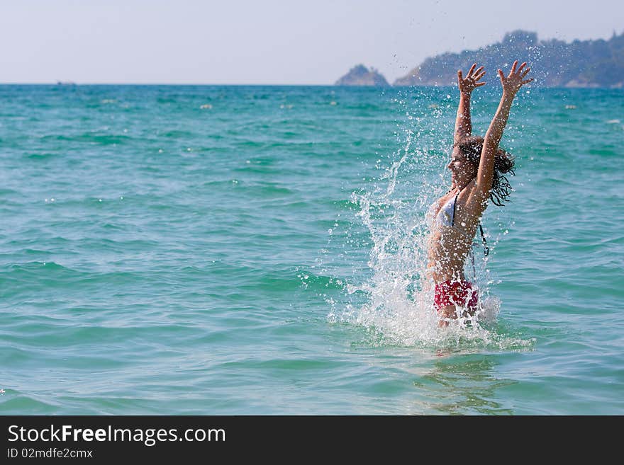 Girl with long hair playing in the sea. Girl with long hair playing in the sea