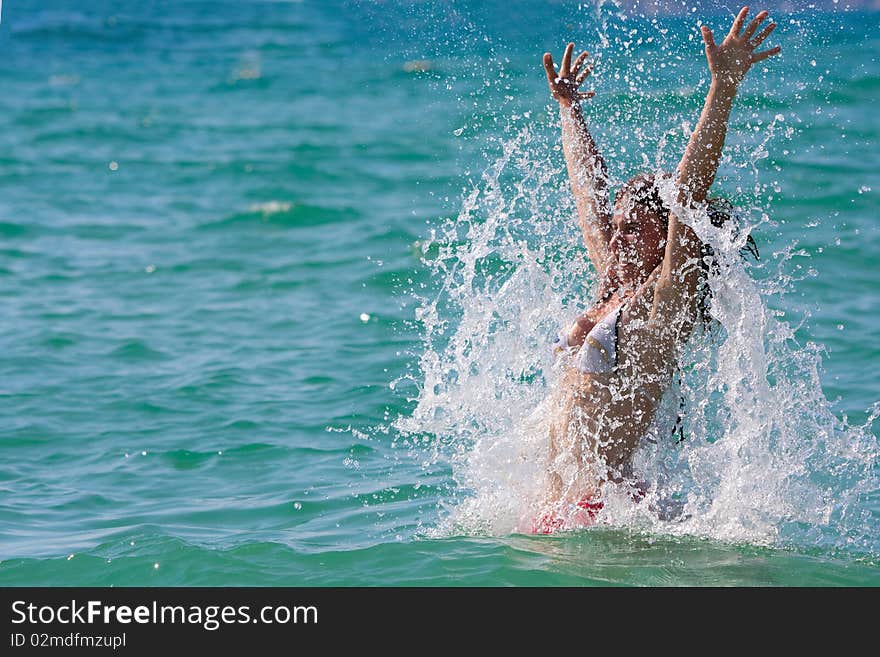 Girl with long hair playing in the sea. Girl with long hair playing in the sea