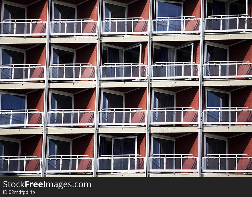 Hotel balconies in sunrise at the sea