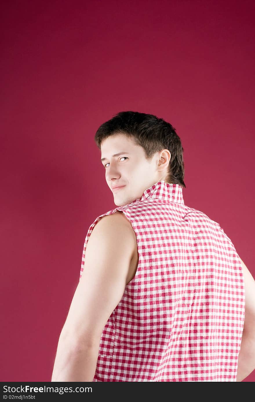 Nice guy on a red background in the studio. Nice guy on a red background in the studio