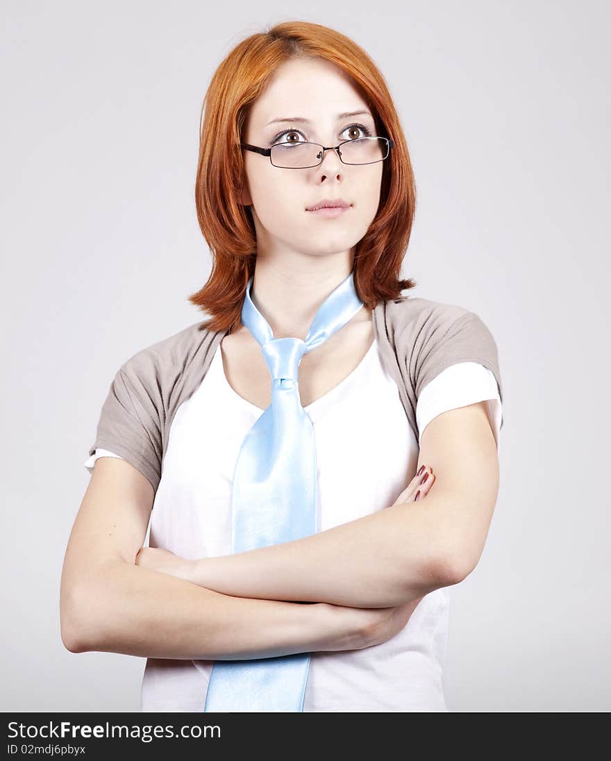 Young Businesswomen in white with tie and glasses