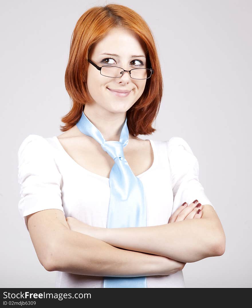 Young Businesswomen in white with tie and glasses