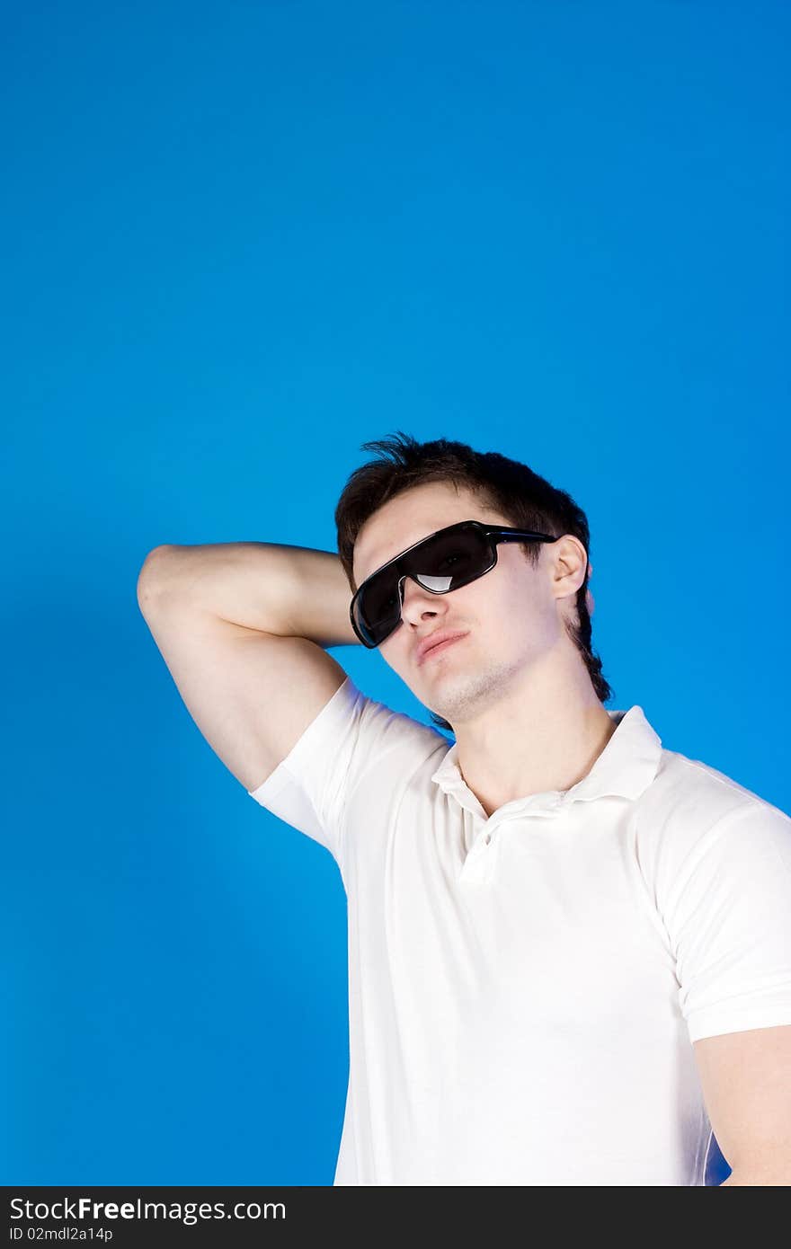 Brave guy in the studio against a blue background. Brave guy in the studio against a blue background