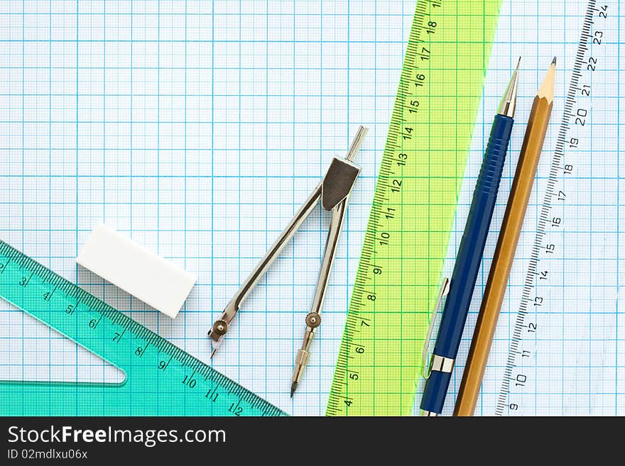 Drawing tools on a graph paper background. Drawing tools on a graph paper background