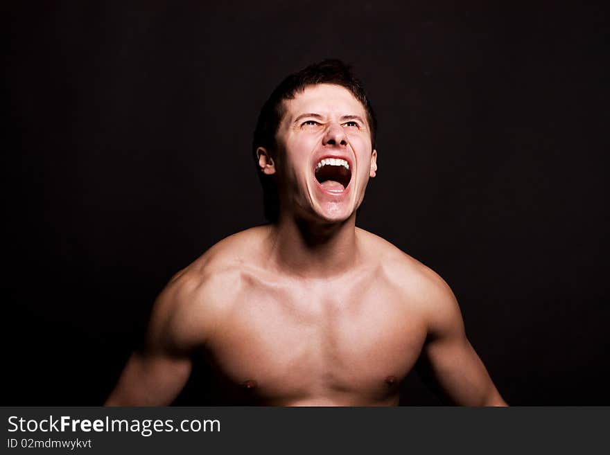 Handsome young man shouting