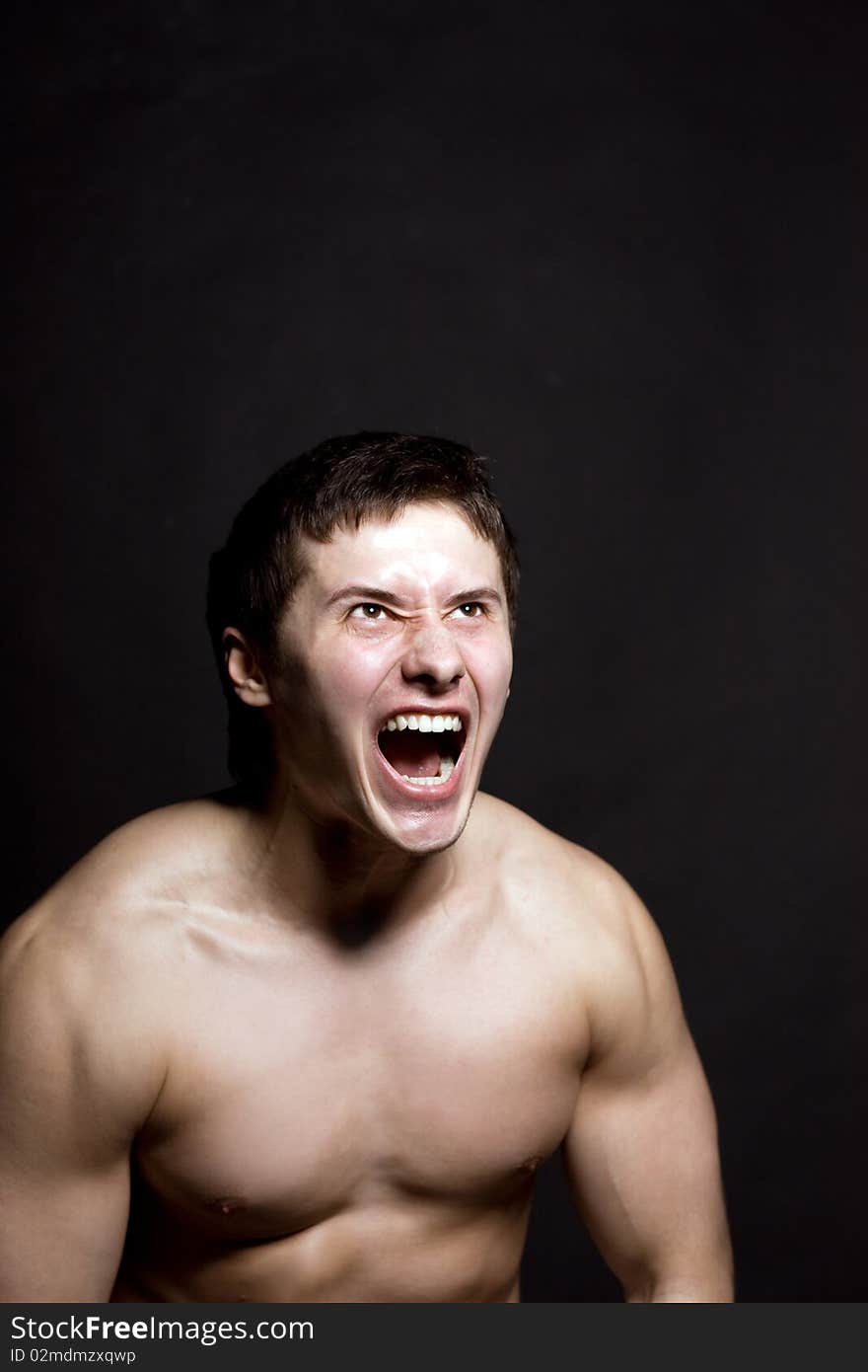 Angry man screaming in extreme rage. Angry man screaming in extreme rage