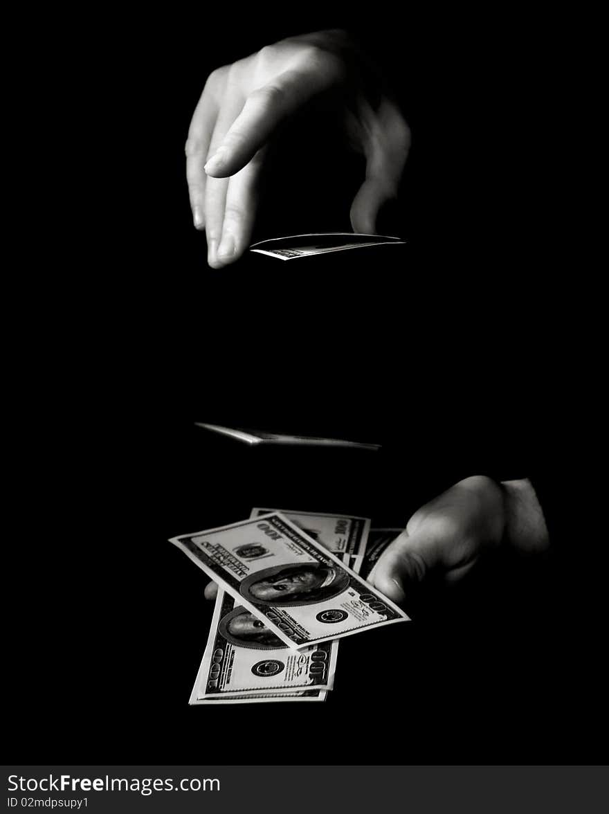 Hands with dollars over black