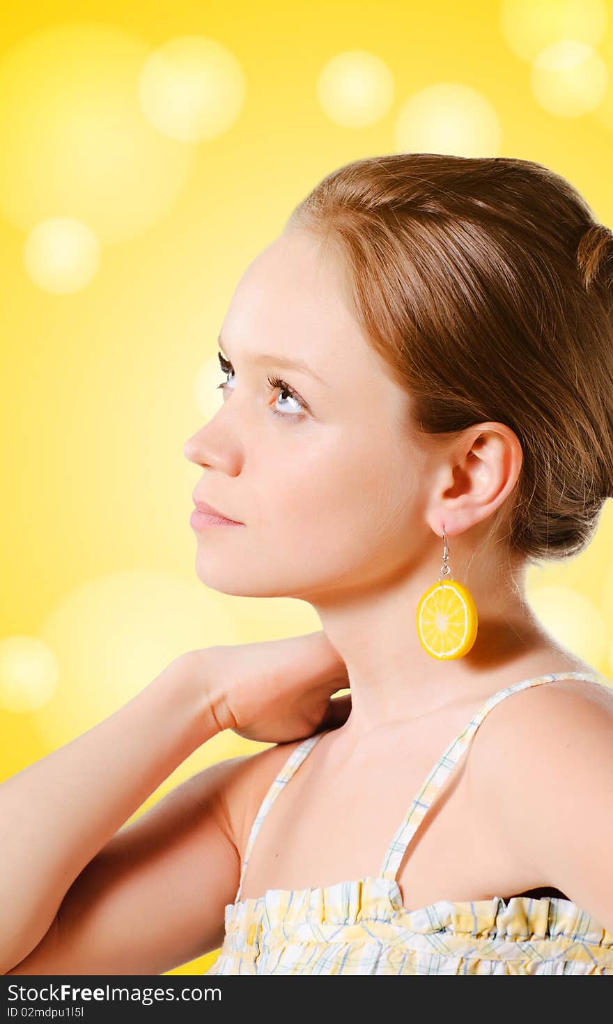 Beautiful young woman in summer clothes on yellow background. Beautiful young woman in summer clothes on yellow background