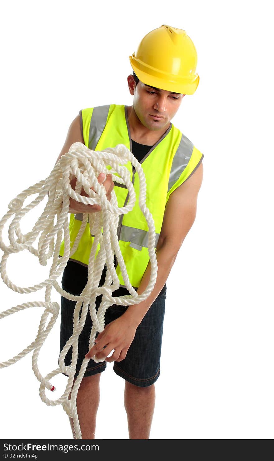 Builder, tradesman or construction worker at work gathering rope.  White background. Builder, tradesman or construction worker at work gathering rope.  White background.