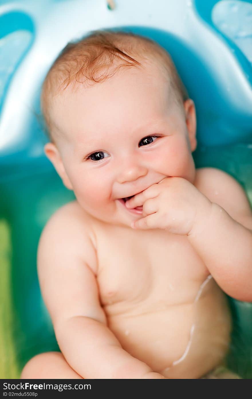 The Small girl bathes in bath