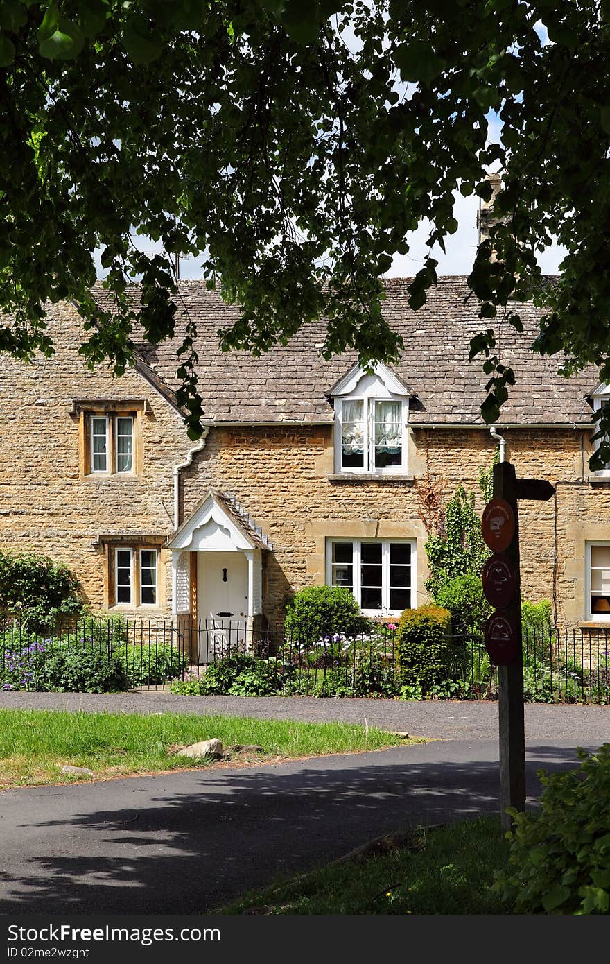 Traditional English village scene of Lower Slaughter in the Cotswolds, Gloucestershire. Copyspace top and bottom. Traditional English village scene of Lower Slaughter in the Cotswolds, Gloucestershire. Copyspace top and bottom