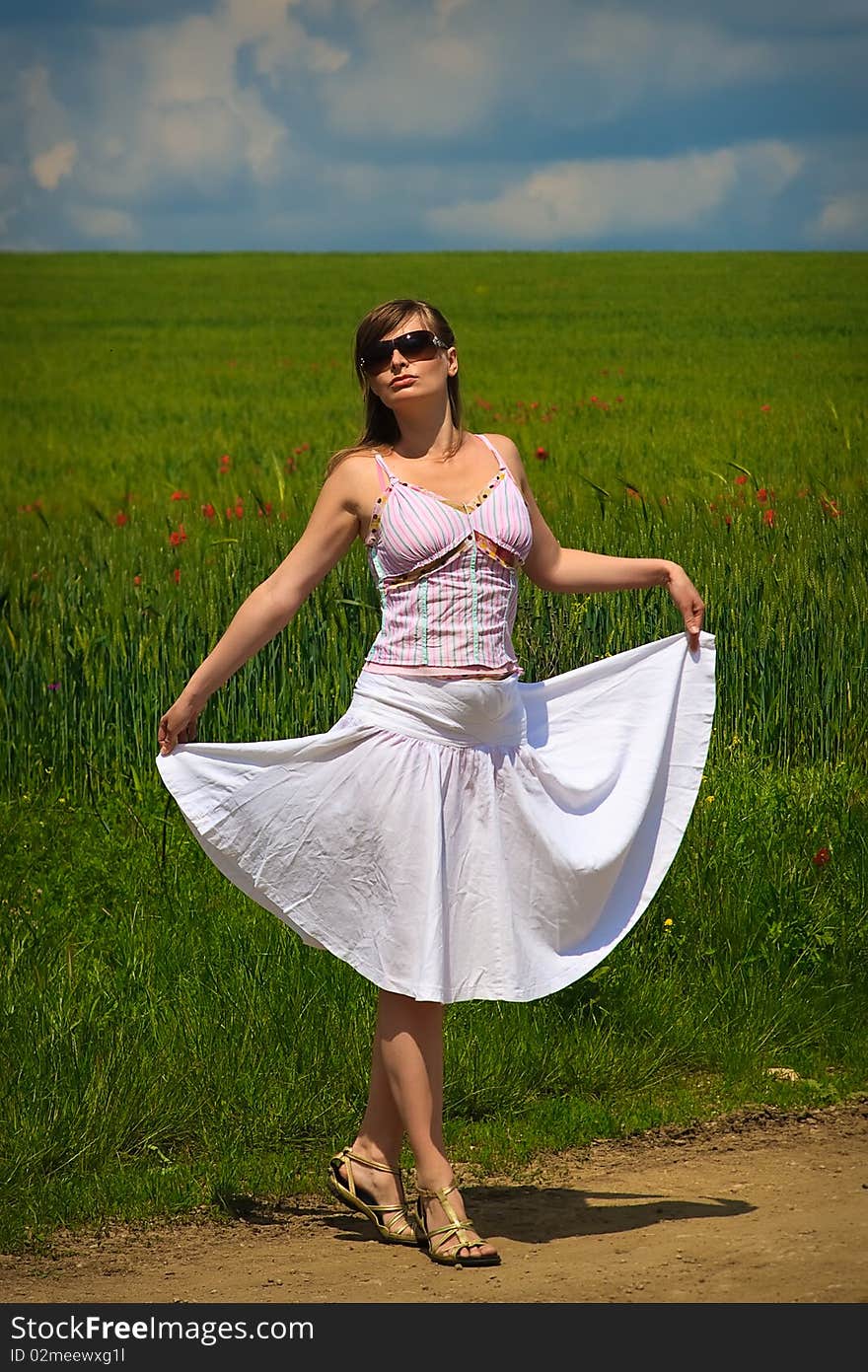 Beautiful young woman and poppies