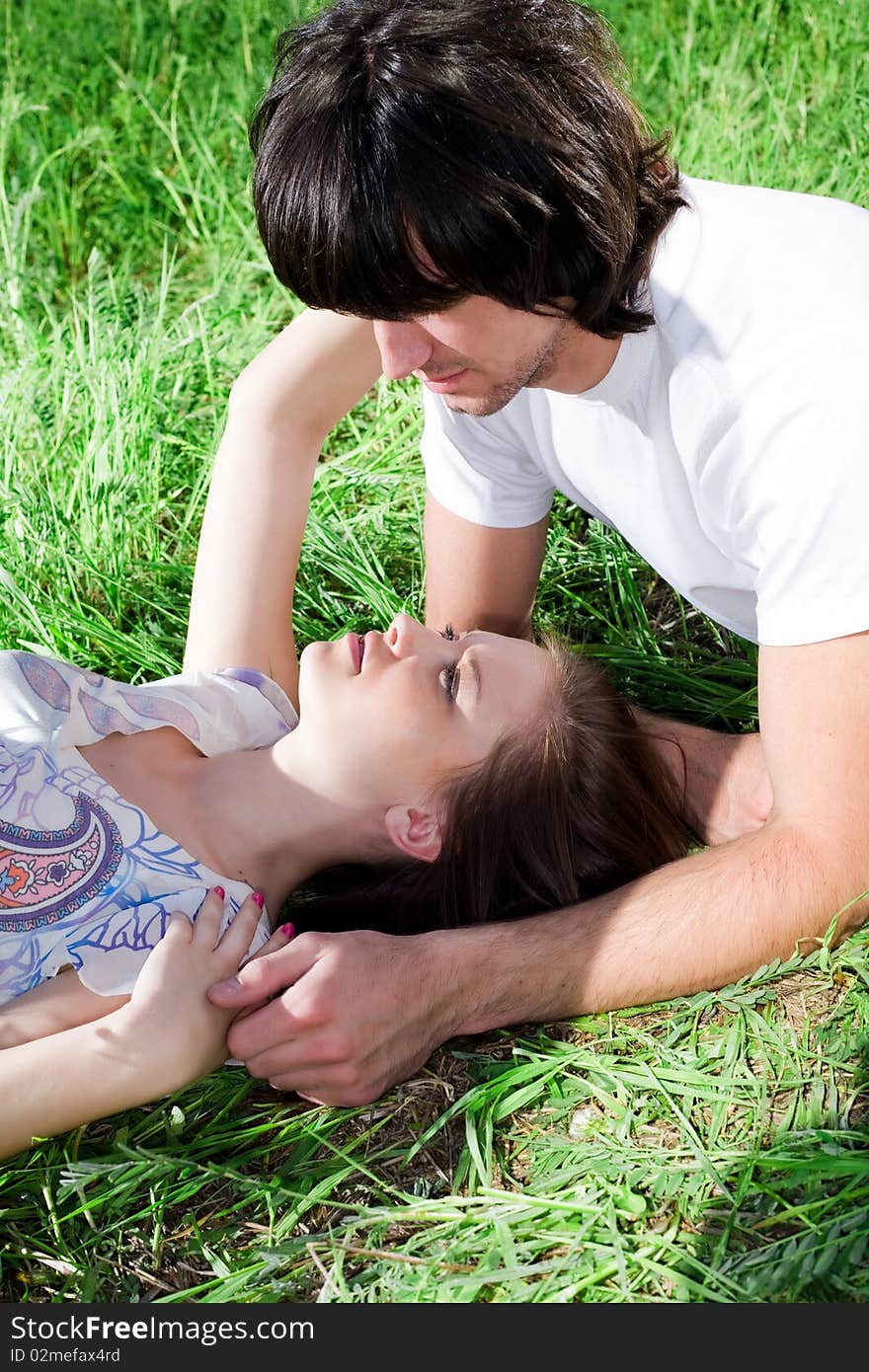 Boy and beautiful girl on green grass. Boy and beautiful girl on green grass