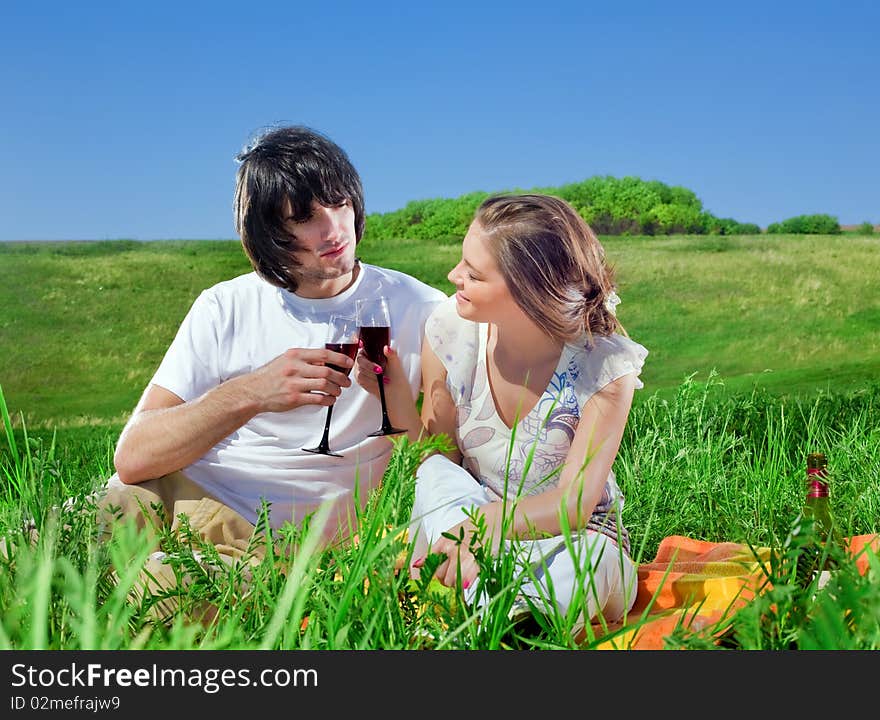 Boy and beautiful girl with wineglasses