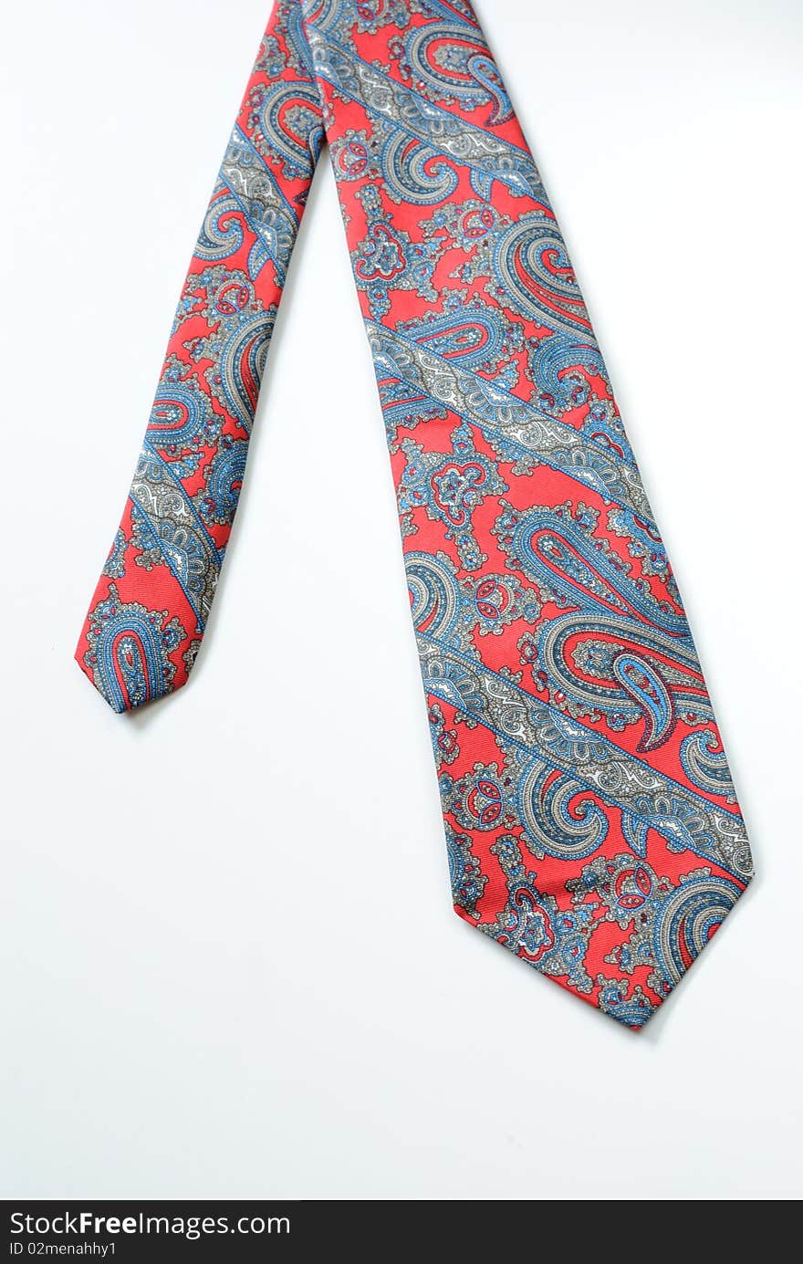 A tie with a paisely design on white. A tie with a paisely design on white.