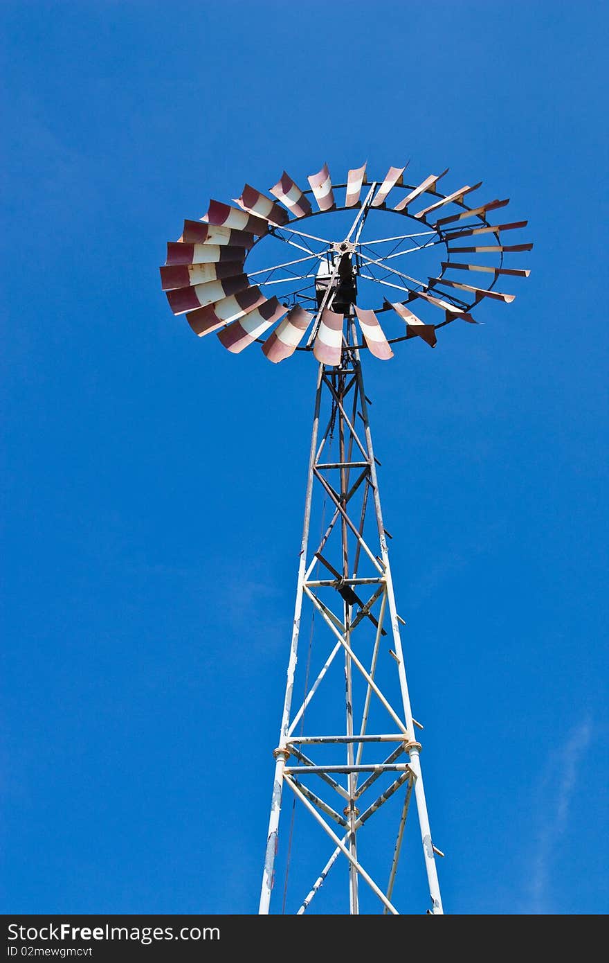 A windmill and blue sky