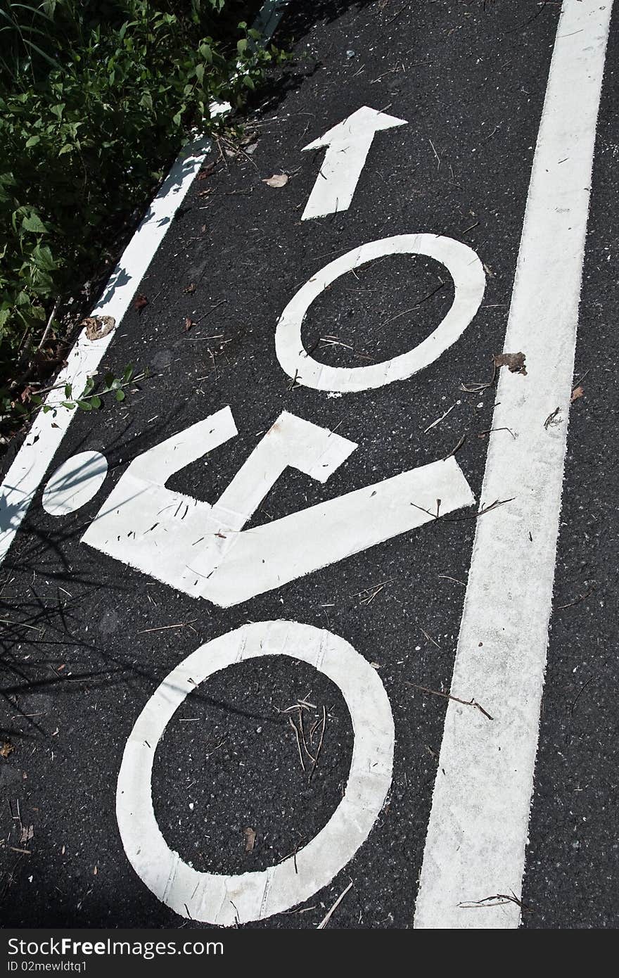 Bicycle road sign painted on the asphalt. Bicycle road sign painted on the asphalt