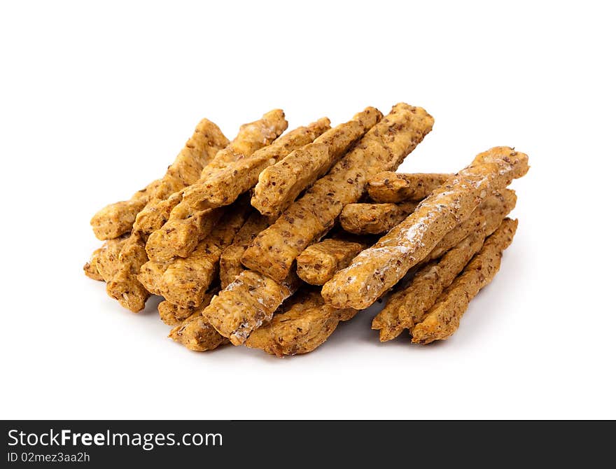 Batch of breadsticks with different kind of seeds on top isolated on white background