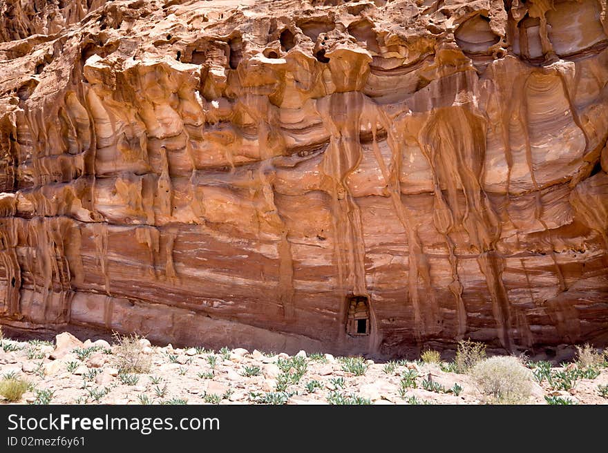 Small door in a big rock near the Monastery. Petra, Jordan