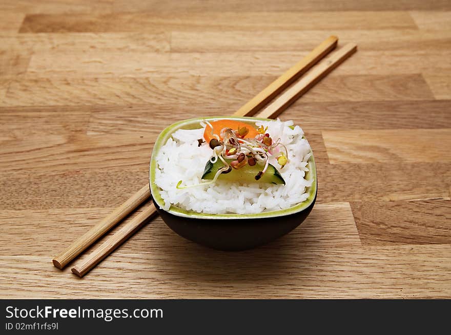 Dish of rice on a table.