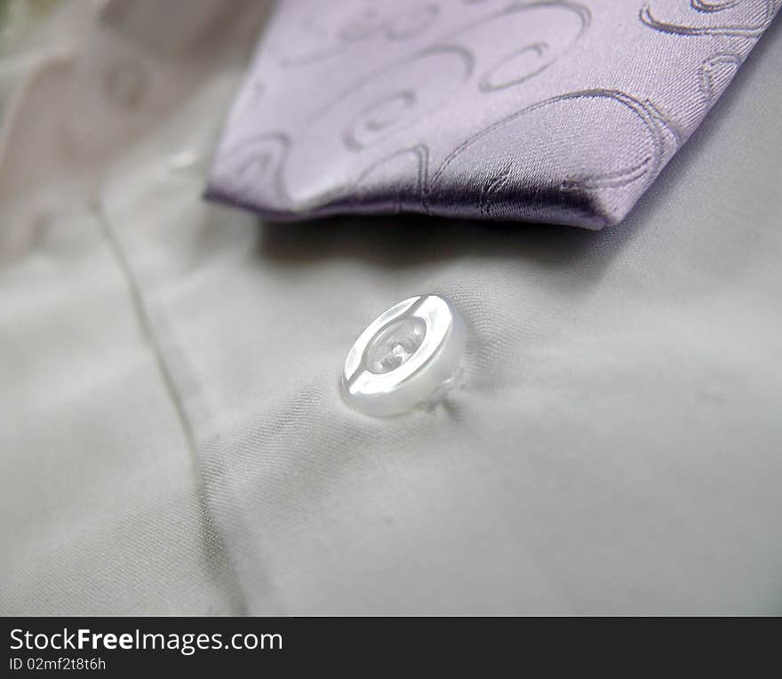 Detail of Lila ornaments tie with white shirt