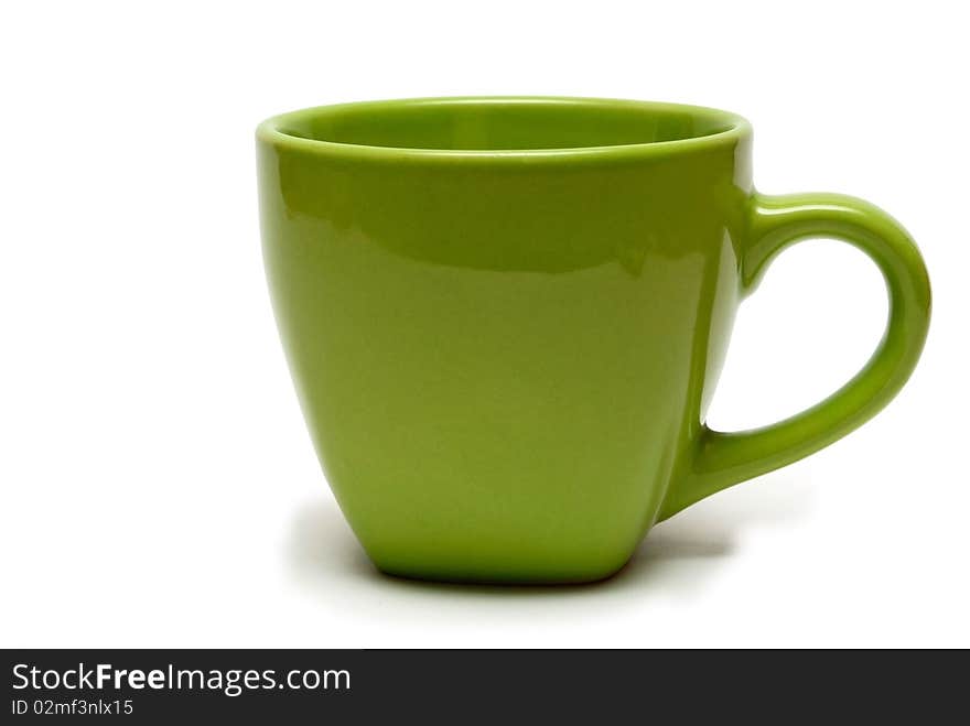 A cup of green on a white background, isolated.