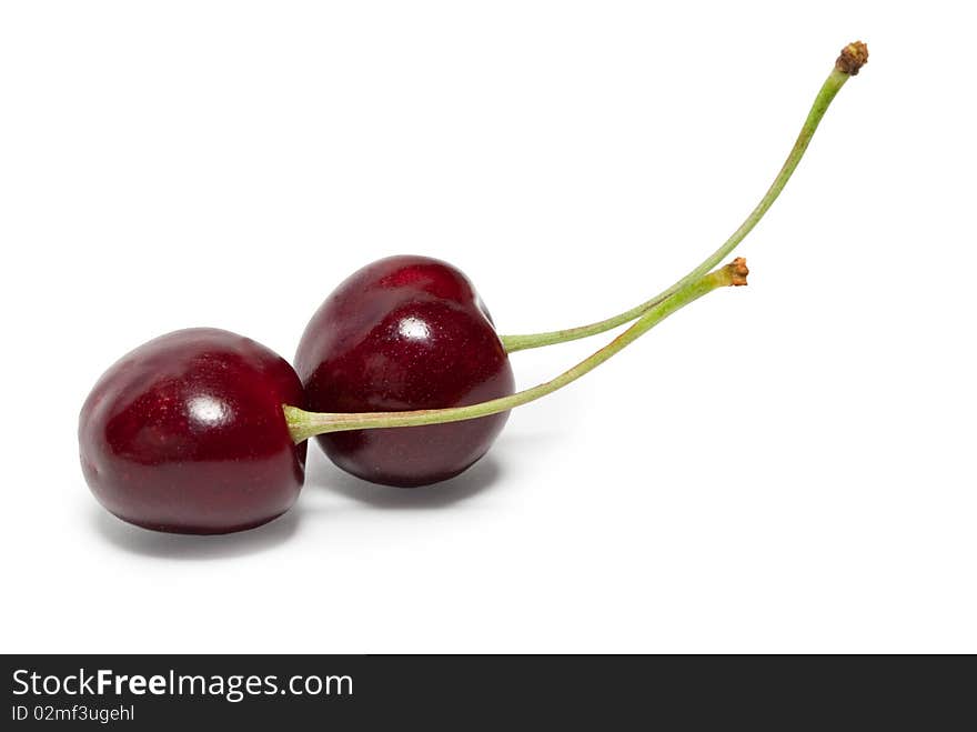 Two cherries are located on the diagonal. Isolated. Two cherries are located on the diagonal. Isolated.