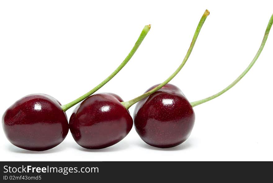 Three cherries are in a row. It is isolated. Three cherries are in a row. It is isolated