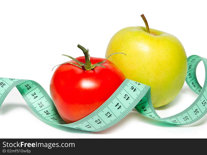 Apple and tomato on a white background. Isolated.