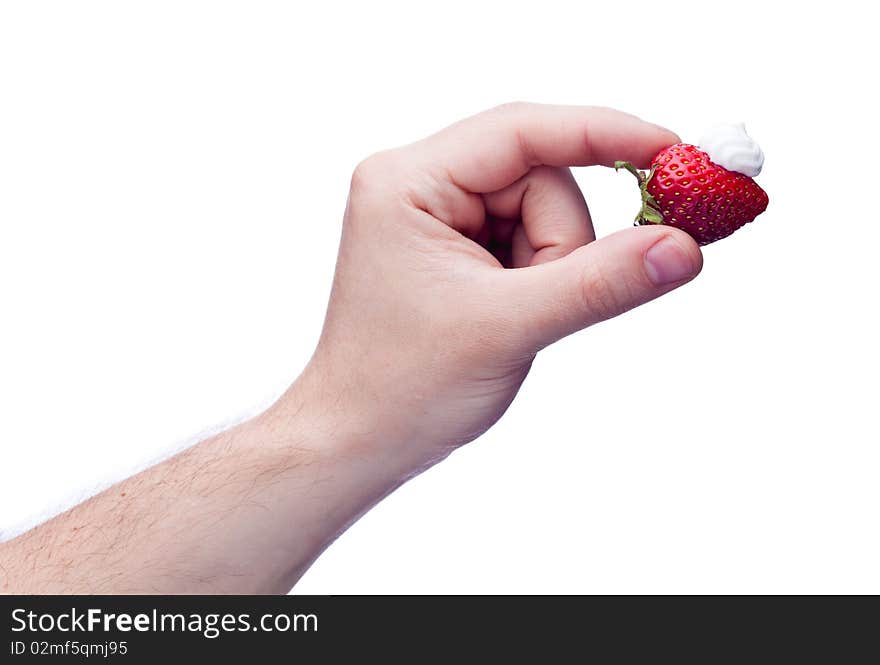 Strawberry with cream in hand isolated on white