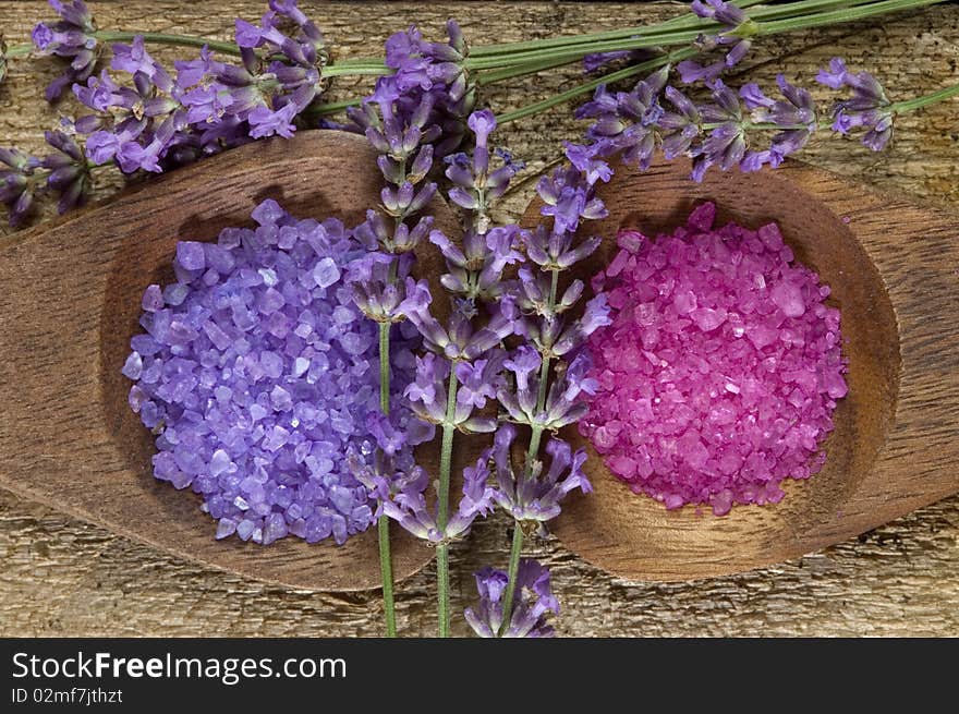 Sea salt with herbs in a wooden spoon