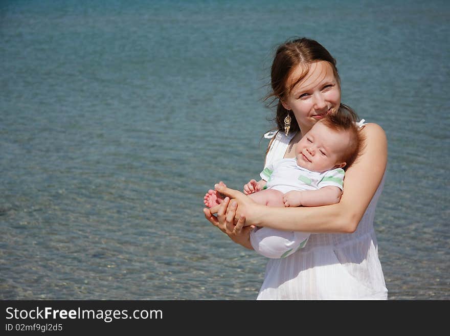 Mother and baby on sea background