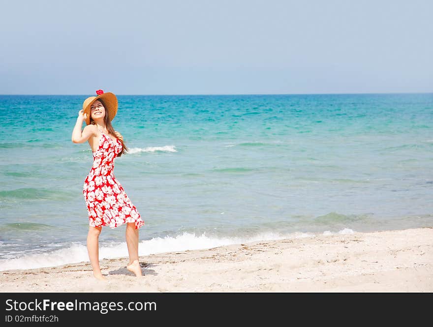 Young happy girl on beach