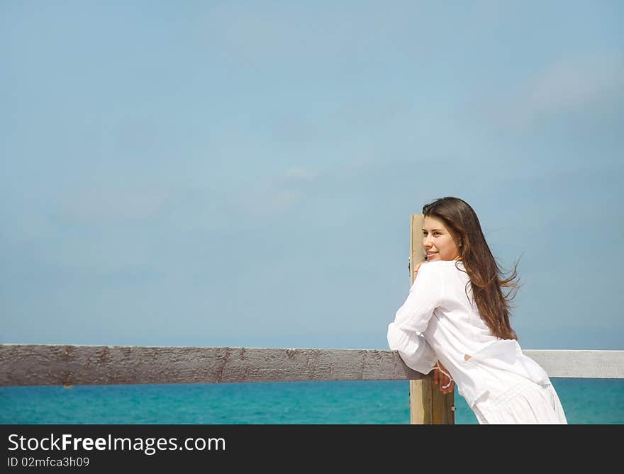 Young romantic girl on sea background