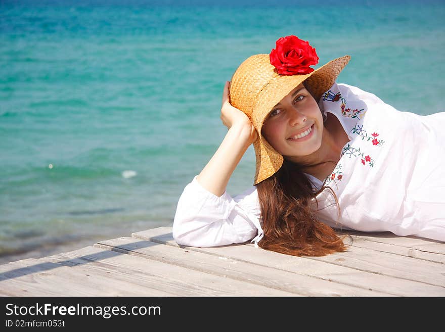 Young happy girl on sea background