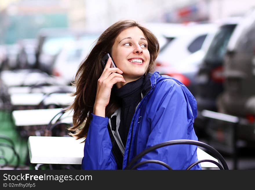 Closeup woman with mobile telephone