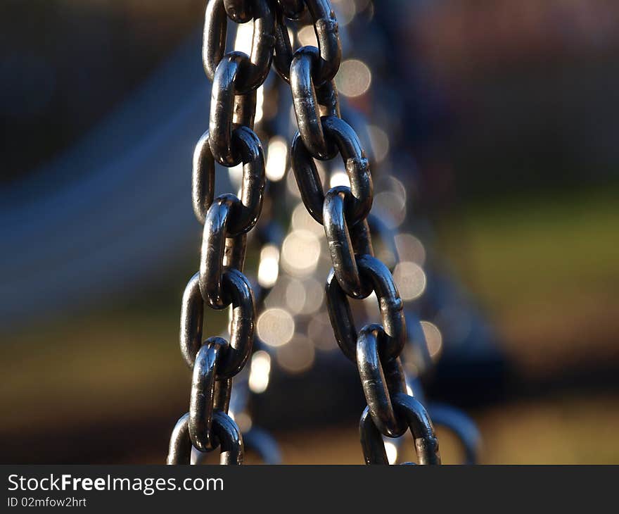 Swing chains in a playground on an autumn day