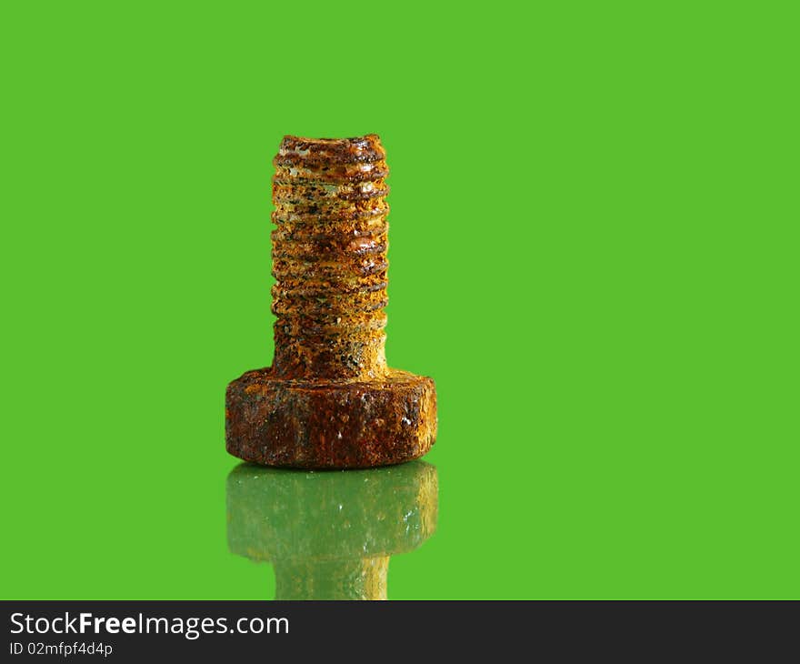 Old rusty on a green background with reflection. Old rusty on a green background with reflection