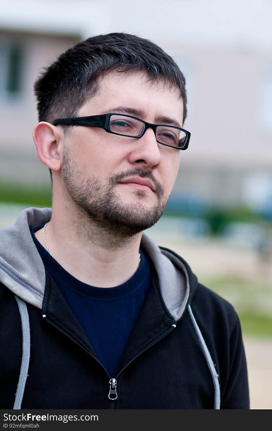 Portrait of a young male caucasian student with beard and glasses. Portrait of a young male caucasian student with beard and glasses