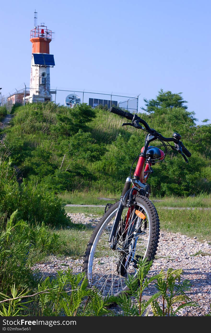 Bike and lighthouse with solar battery.