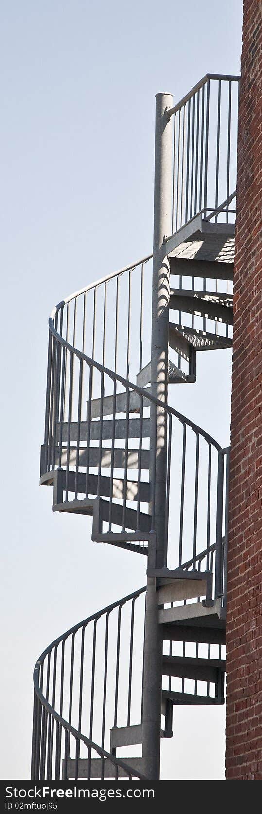 This is a spiral stairway on the side of a building.