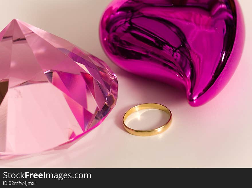 gold rings and heart on a white background. gold rings and heart on a white background