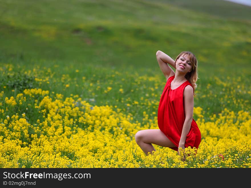 The girl in a blossoming field